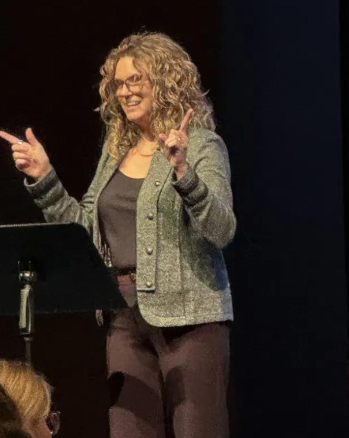 Karen speaking on stage
